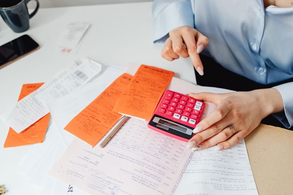 Travel nurse tax documents and receipts organized on a desk