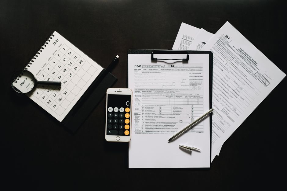 State tax forms and calculator on a desk